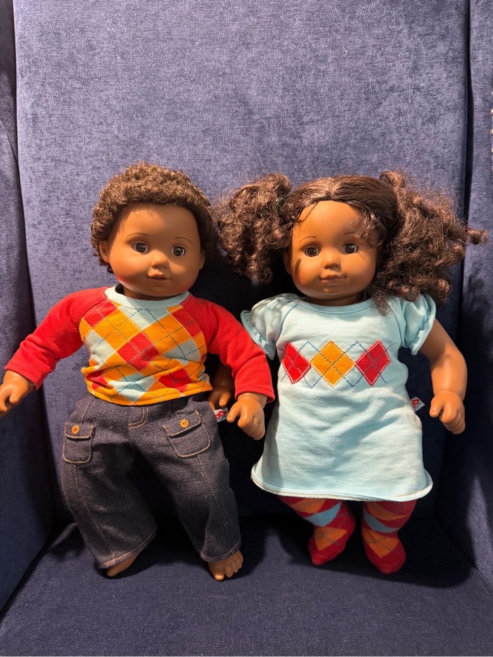 American Girl Brown-Skinned Dolls in Red & Light Blue Argyle Outfits